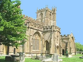 St Bartholomew's Church West front showing tower and gravestones