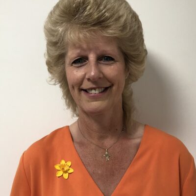 An image of Rosan in an orange shirt